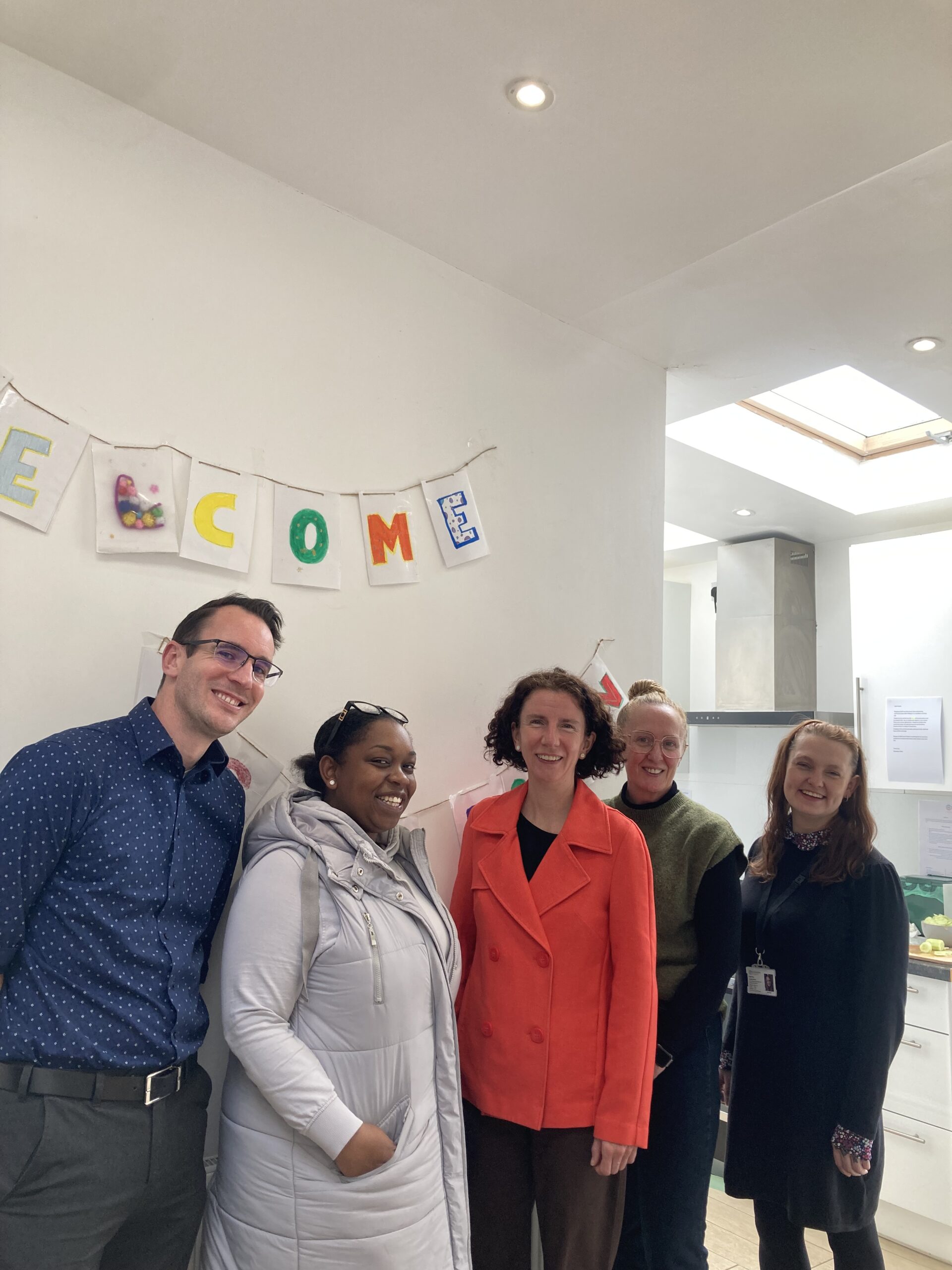 Anneliese with four staff at step down housing in Oxford East run by Connection Support.